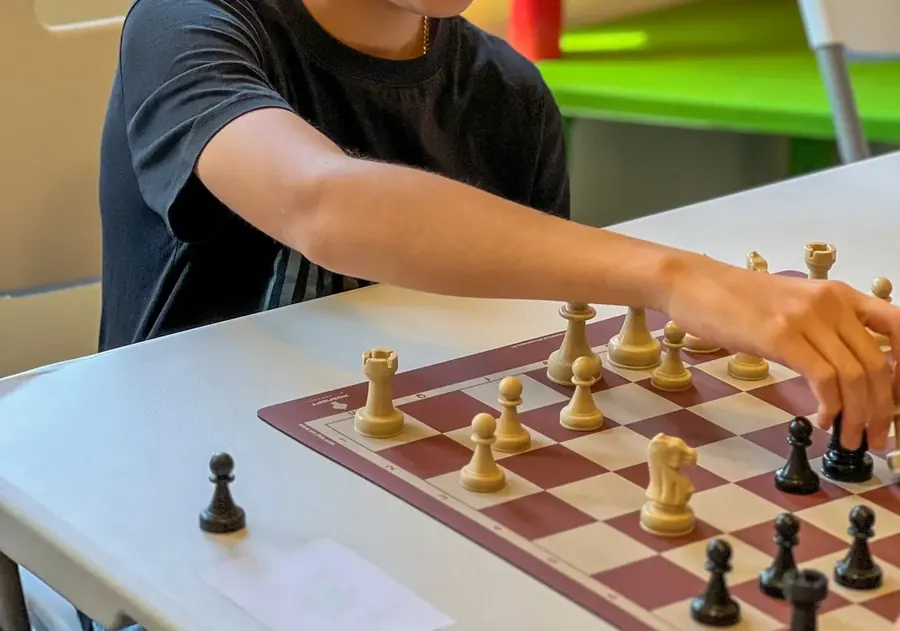 Two children playing chess